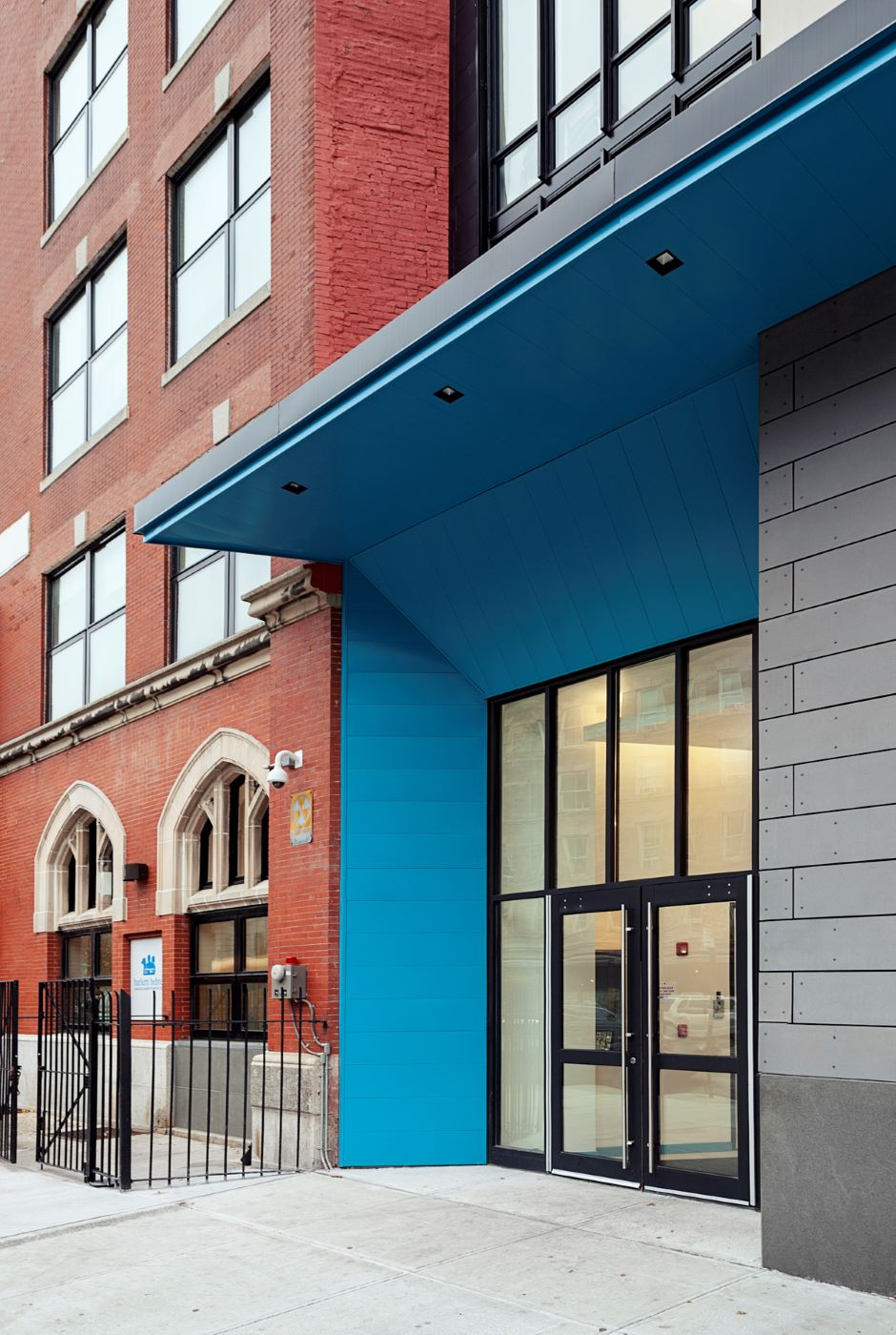 blue entryway to a brick building