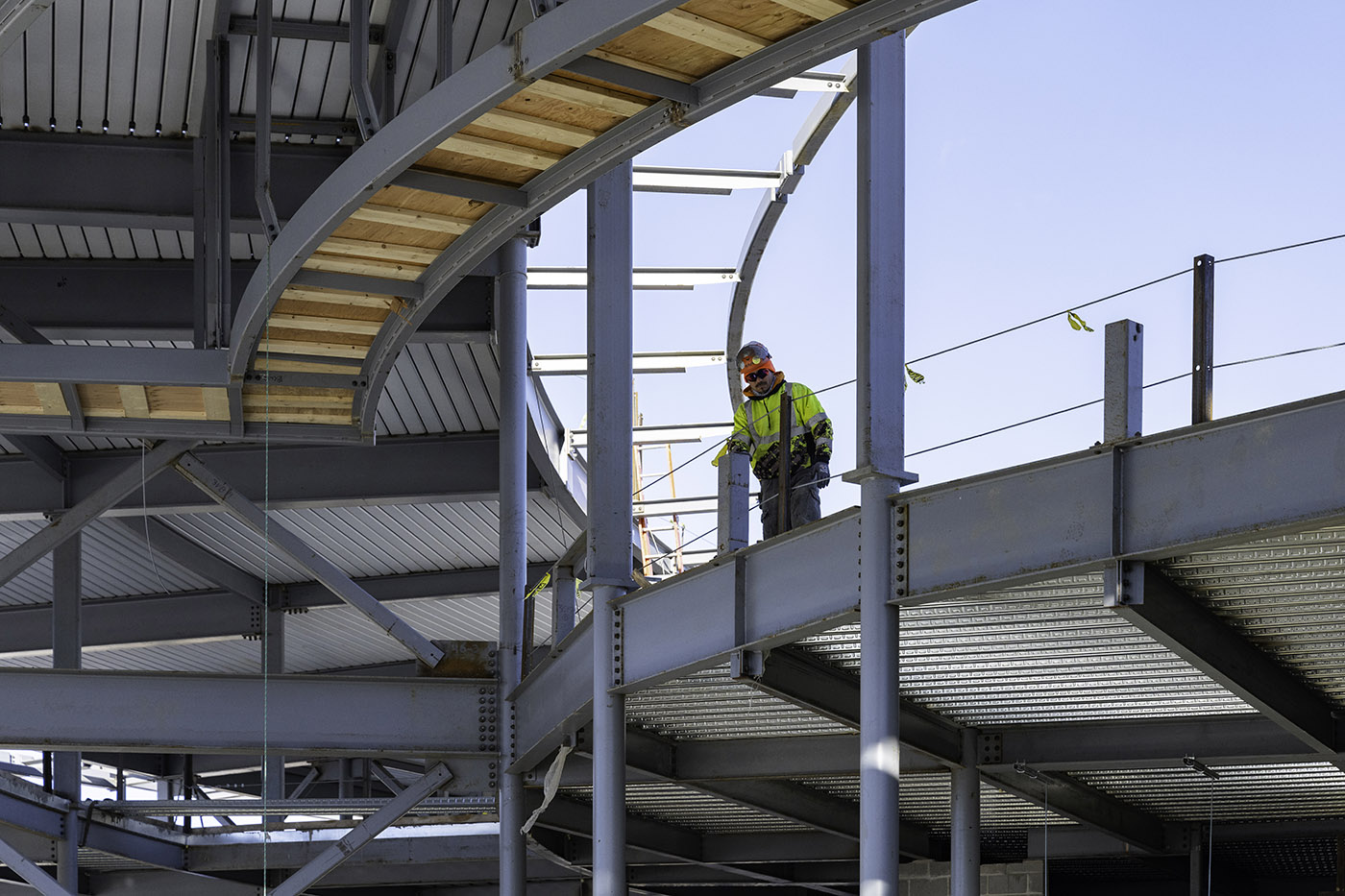 Construction worker on steel-framed building site