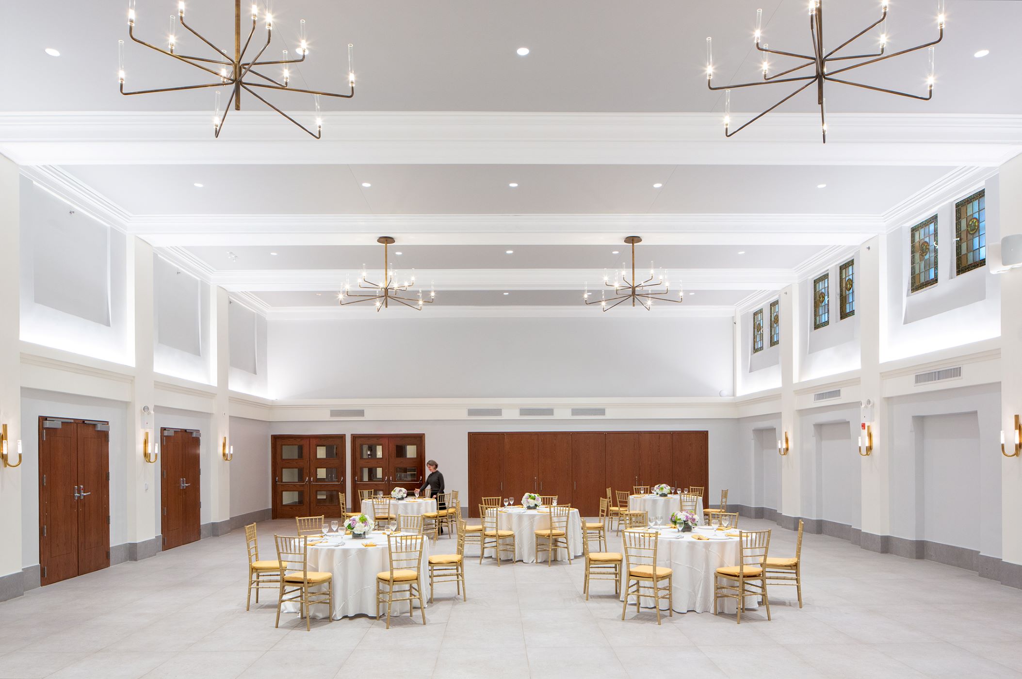 large open events space with multiple circular tables set up