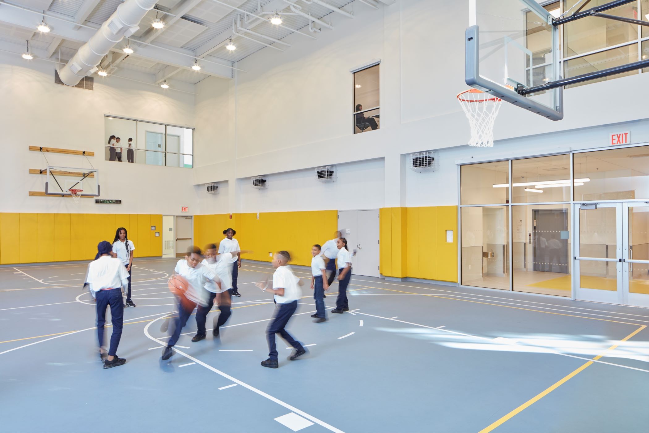 Kids playing basketball in the gymnasium