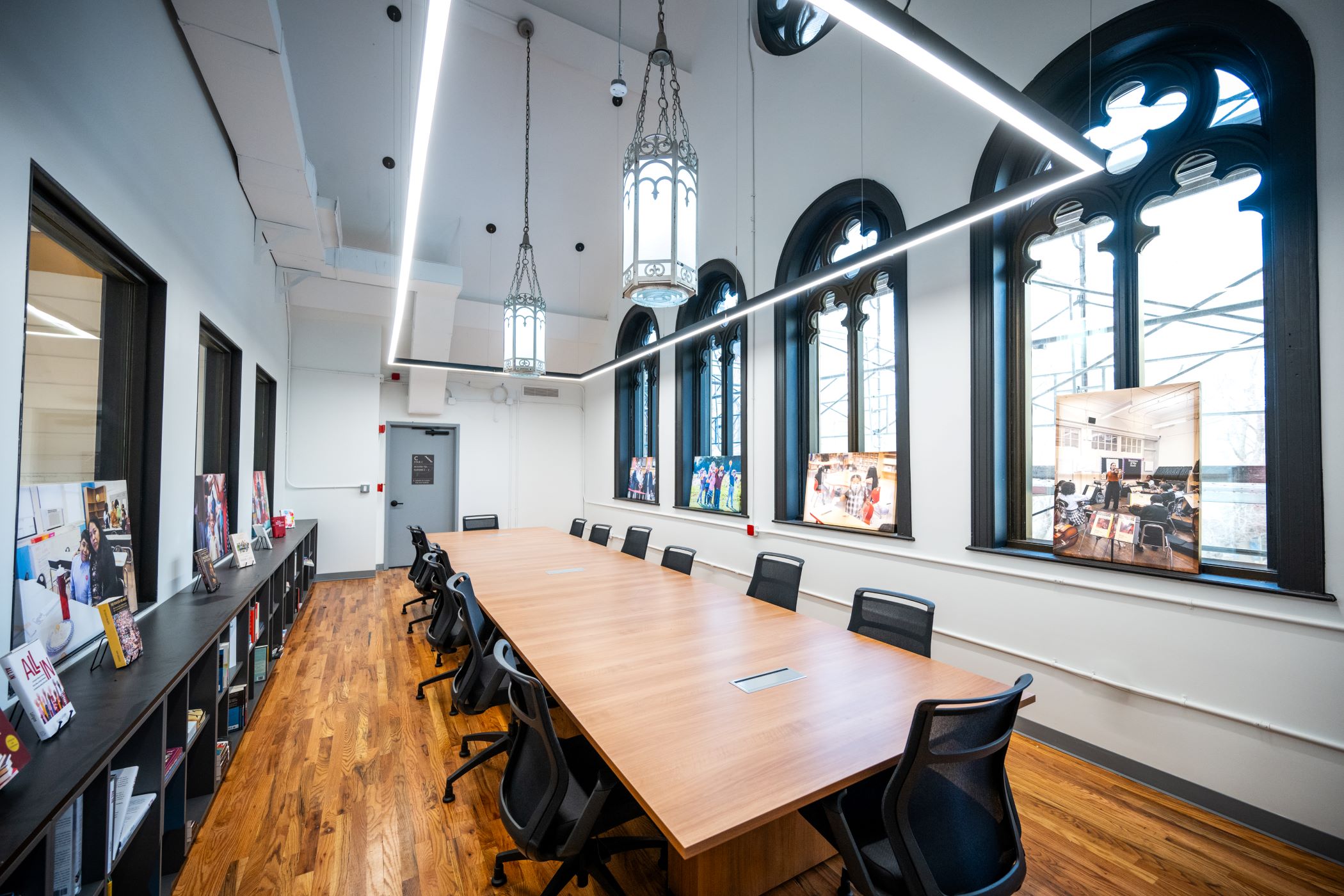 conference room with one large table, ornate church windows