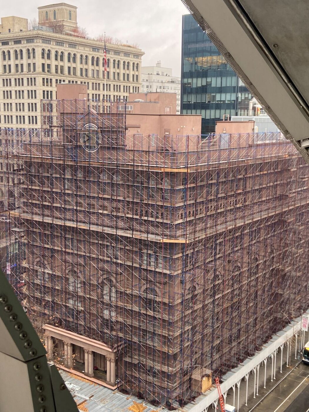 a historic building completed covered in scaffolding