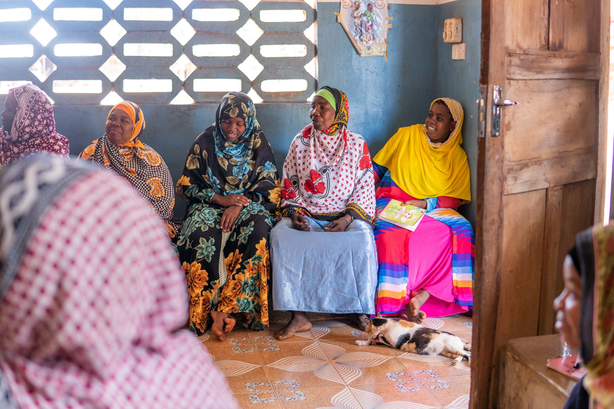 women waiting in a line at the healthcare facility in tanzania