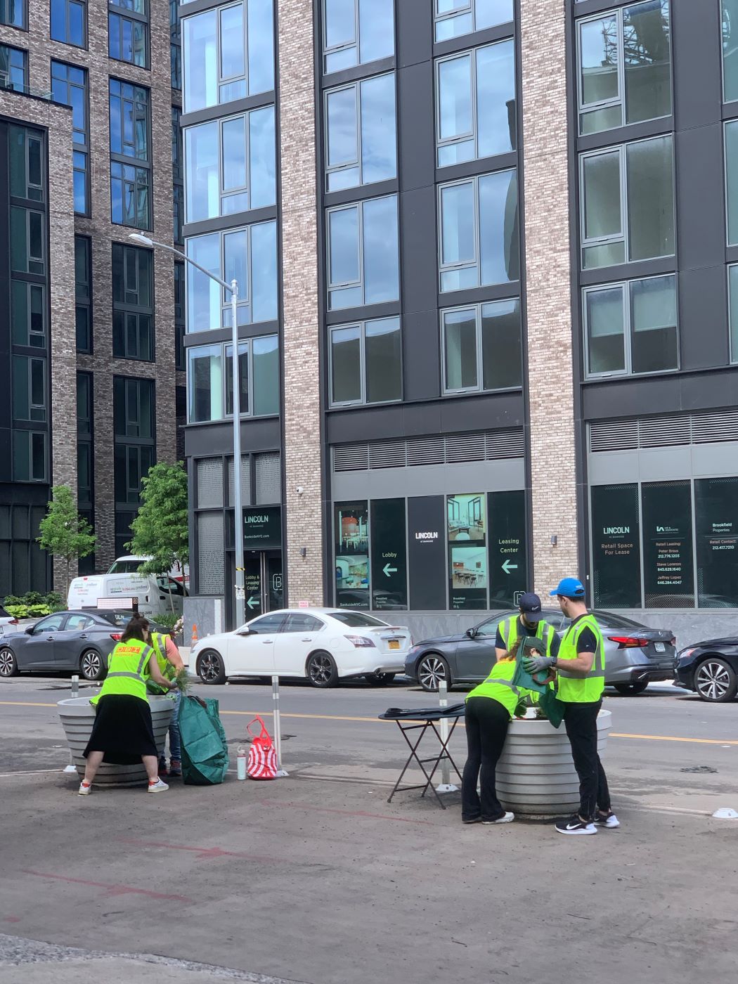 volunteers work on roadside planters