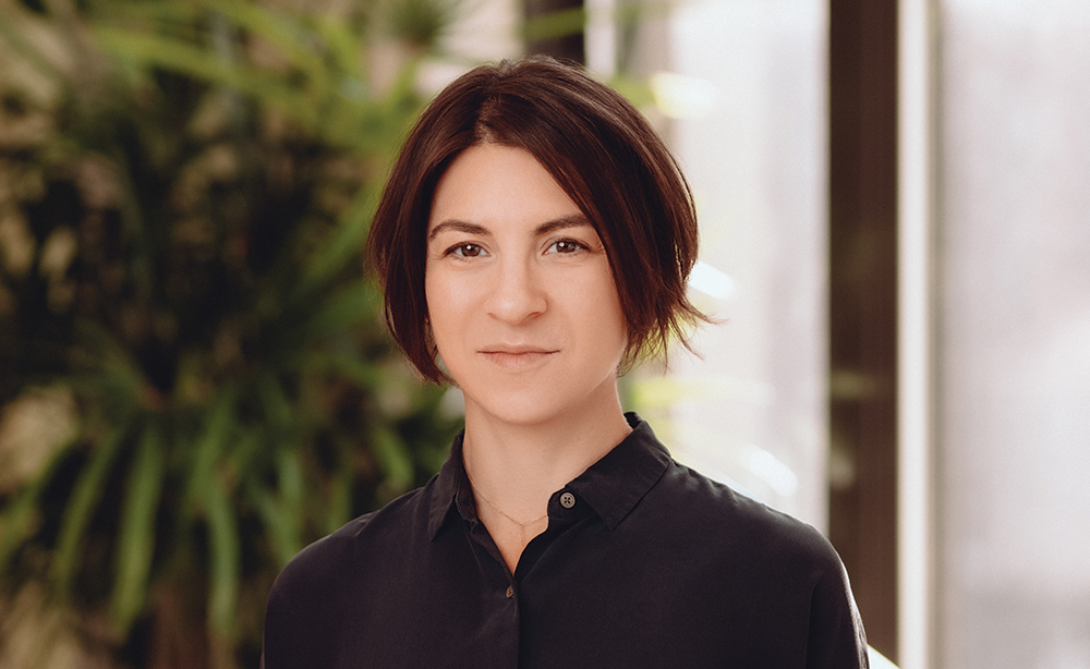 Woman in a black shirt in an office