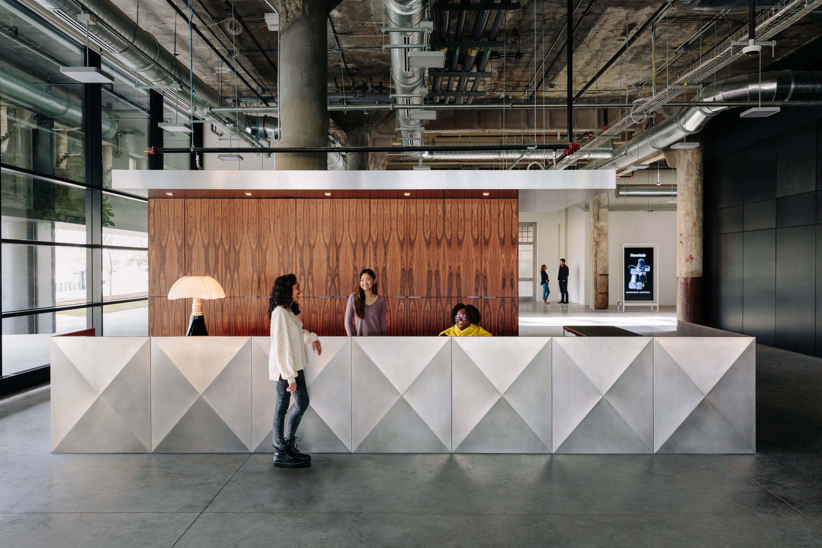 Metal reception desk in converted warehouse