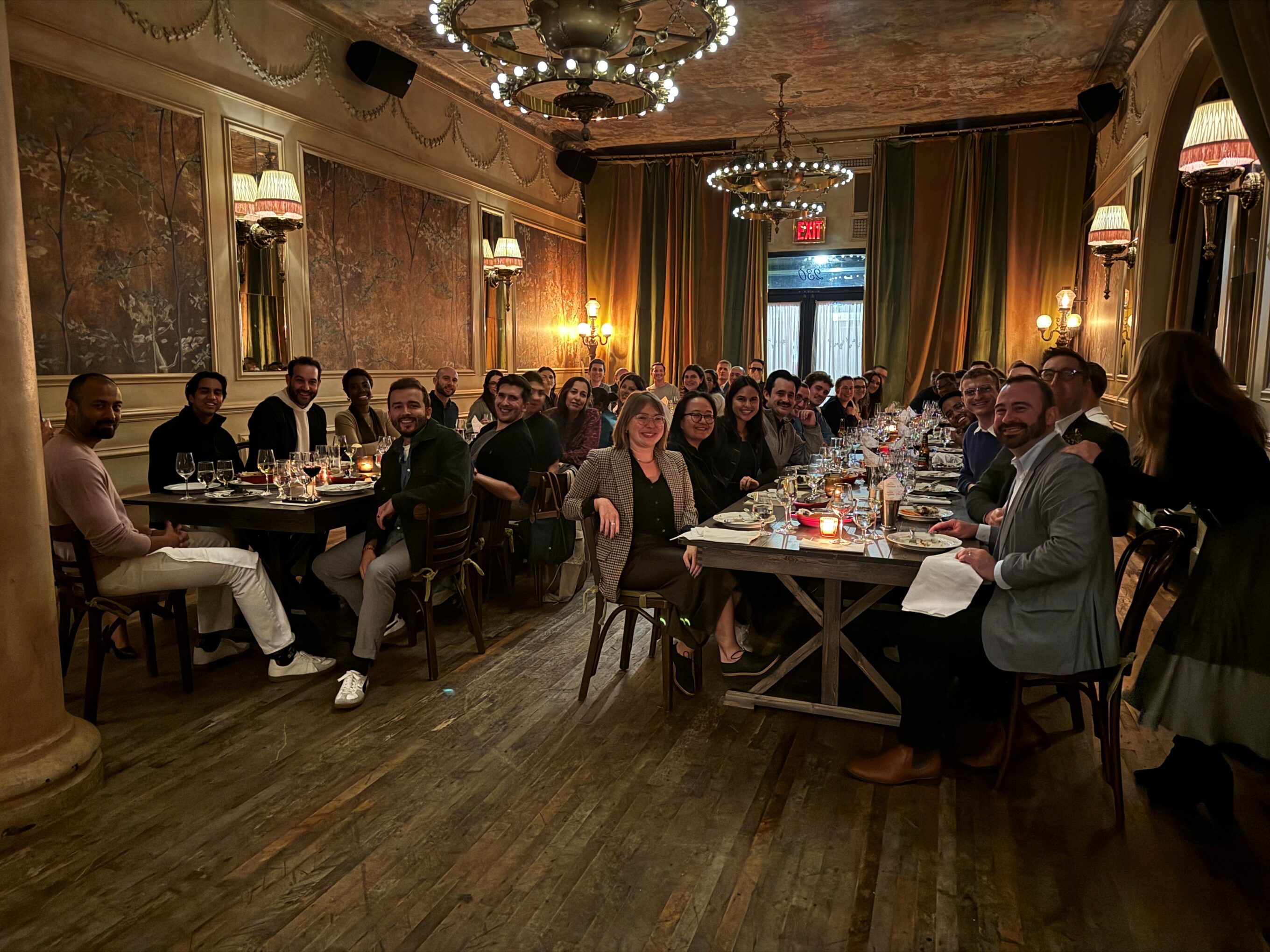 Two tables of people at hotel restaurant