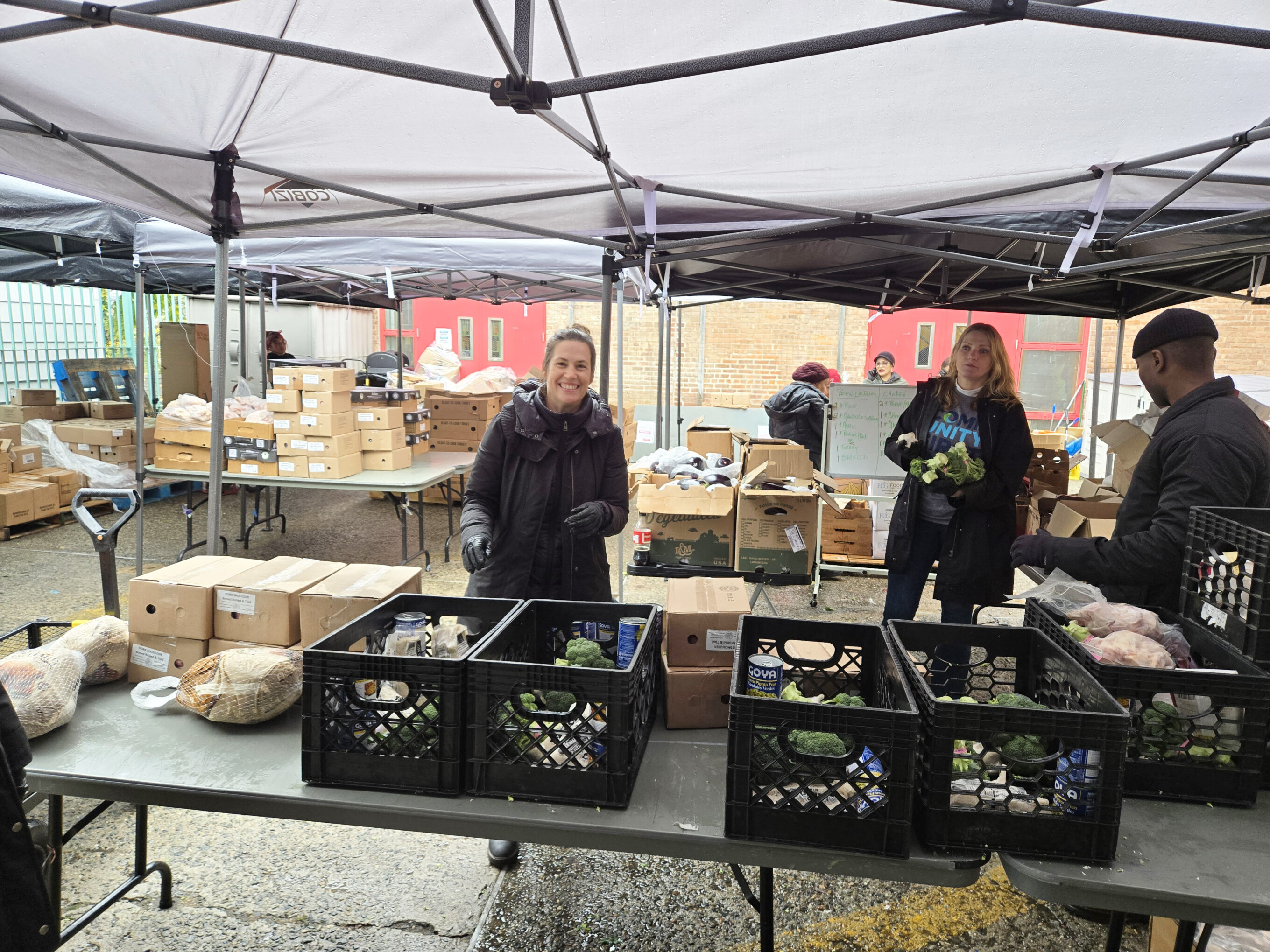 Volunteers giving away food at Bronx community center