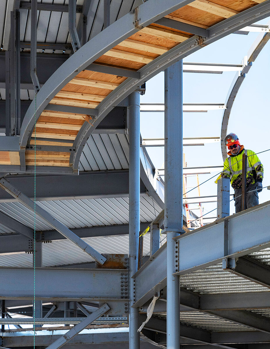 Construction worker on steel-framed building site