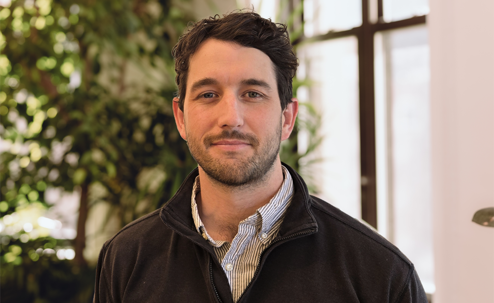 headshot of an employee with a blurry background