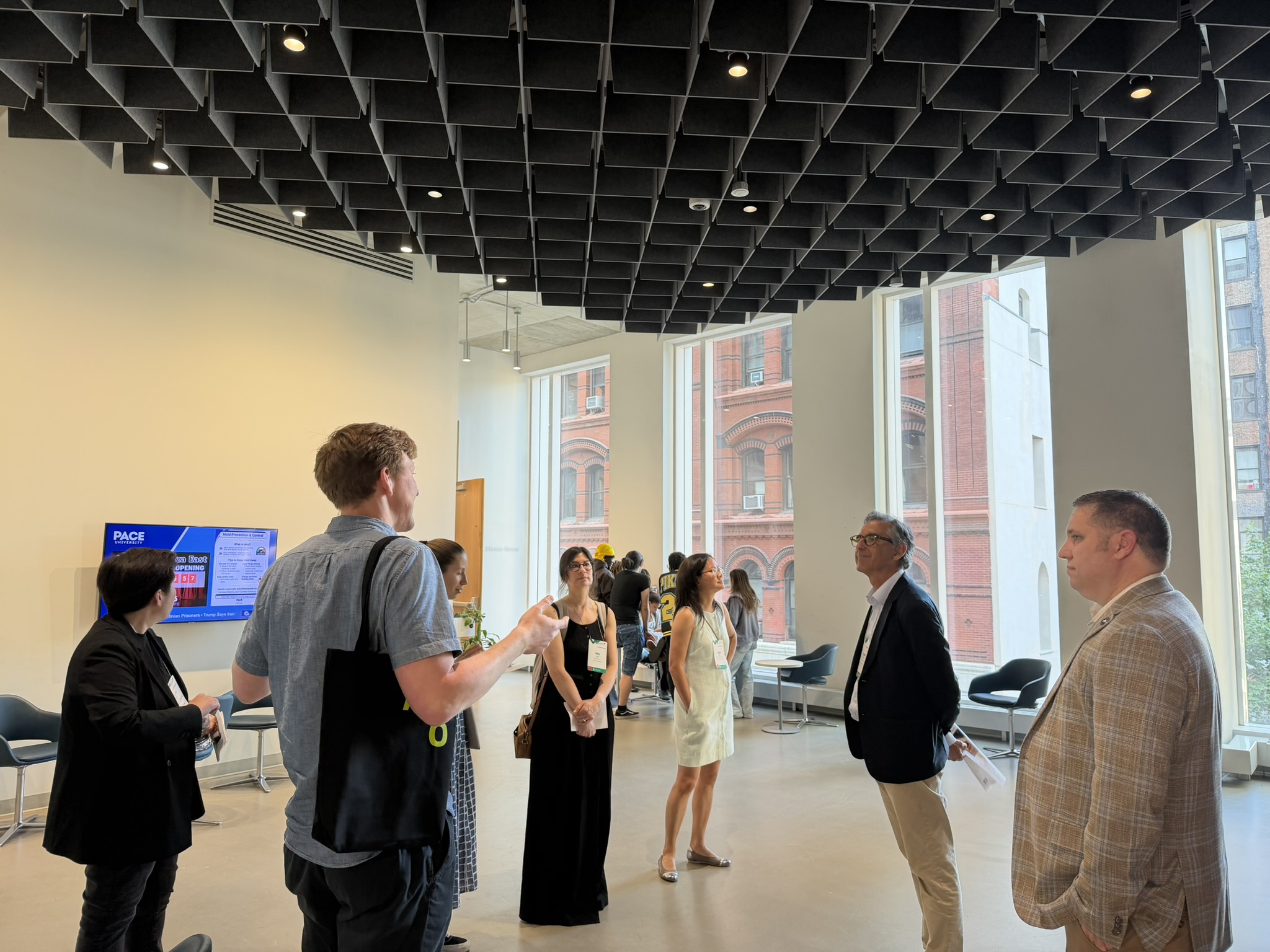 Group of people touring university common space